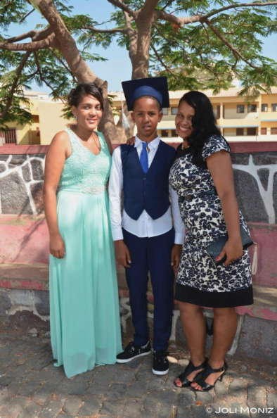 Giovanny with his teacher, Ms. Gilda, and his mom at his elementary school graduation ceremony